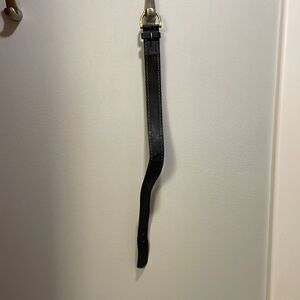 Woman’s black leather belt